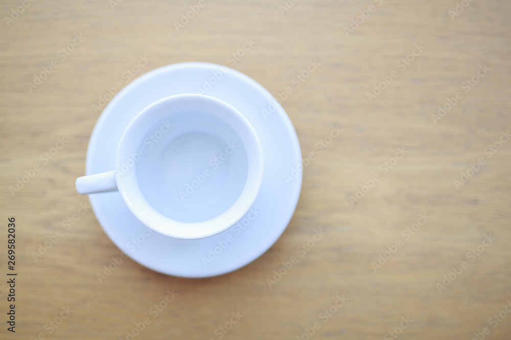 wooden table white Cup and saucer top view wooden table white Cup and saucer top view