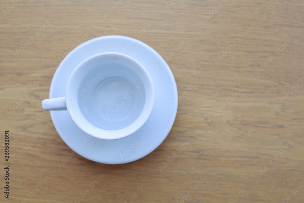 wooden table white Cup and saucer top view wooden table white Cup and saucer top view