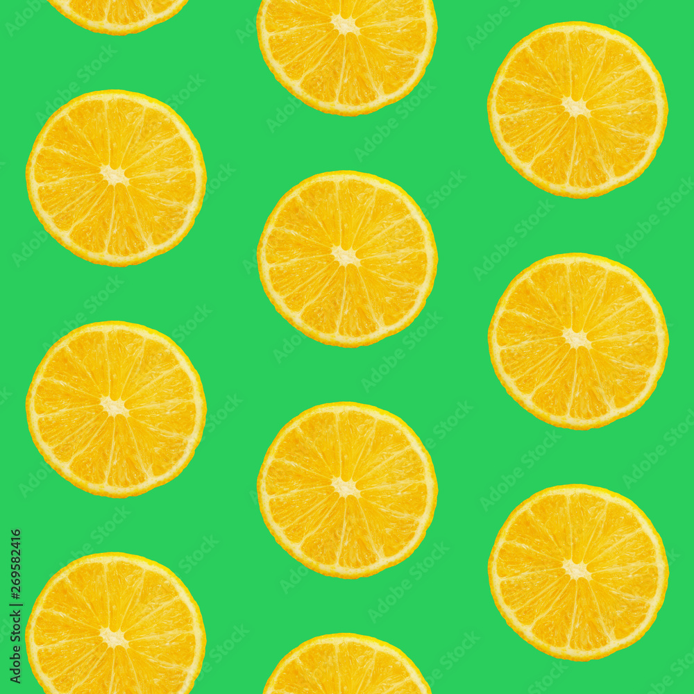 Seamless pattern of oranges on green background