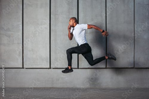 Athletic young man running