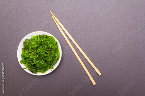 Traditional Japanese Hiyashi Wakame Chuka seaweed salad with sesame seeds.