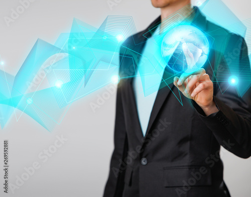 Wallpaper Mural Businessman holding the glowing hologram digital globe. Concepr of business and innovation Torontodigital.ca