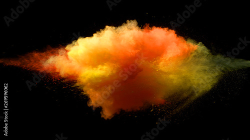 Collision of colored powder isolated on black