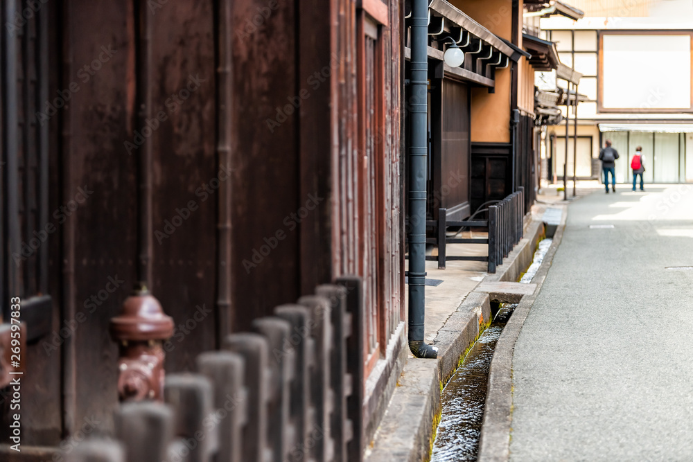 Takayama, Japan small canal gutters in Gifu prefecture view of traditional houses in mountains in city Takayama, Japan small canal gutters in Gifu prefecture view of traditional houses in mountains in city