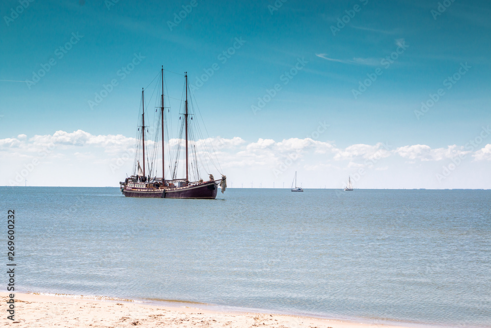 Beautiful old sailing yacht on the IJssellake nearby Stavoren, province Friesland, region Gaasterland in the Netherlands Beautiful old sailing yacht on the IJssellake nearby Stavoren, province Friesland, region Gaasterland in the Netherlands
