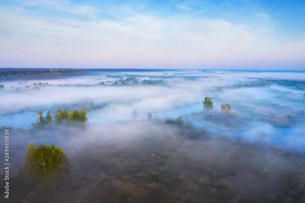 Aerial view foggy morning nature landscape. Fog over summer forest