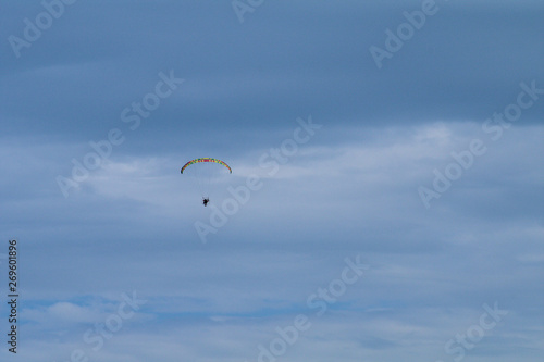 paragliding in the sky,motorized,extreme, flying, adventure, air, freedom, clouds, glider,, gliding, flight, cloud, sports, activity, wind, high, 