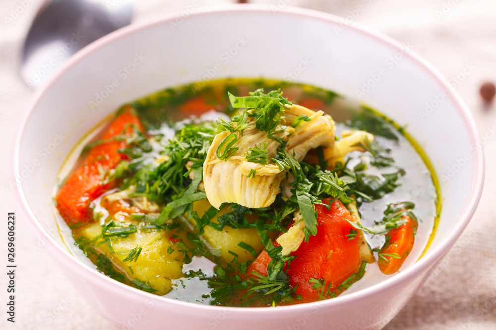 homemade soup with chicken and vegetables. closeup homemade soup with chicken and vegetables. closeup