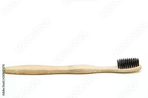 A toothbrush from natural materials. Made from bamboo wood. Isolated on a white background.  