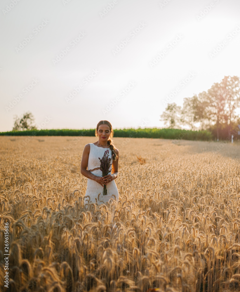 Bride portrait shooting in the field during the sunset time in the golden hour Bride portrait shooting in the field during the sunset time in the golden hour