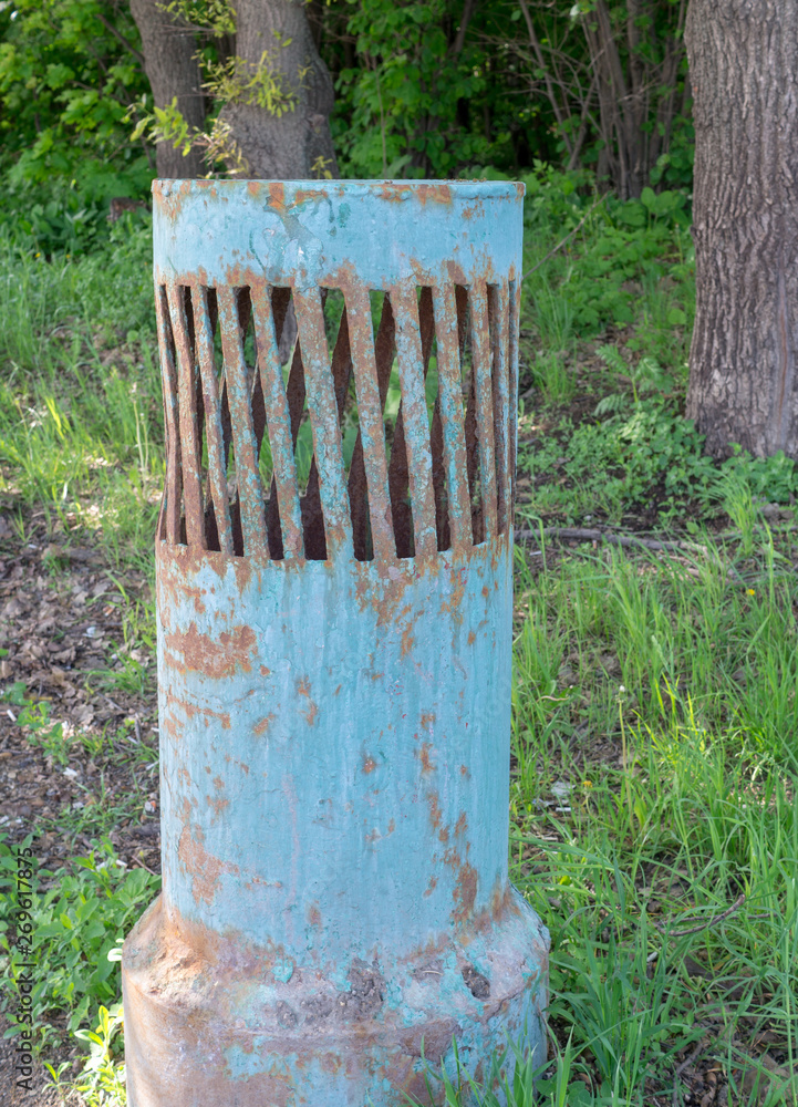 old street vent tube painted green. background, industrial. old street vent tube painted green. background, industrial.