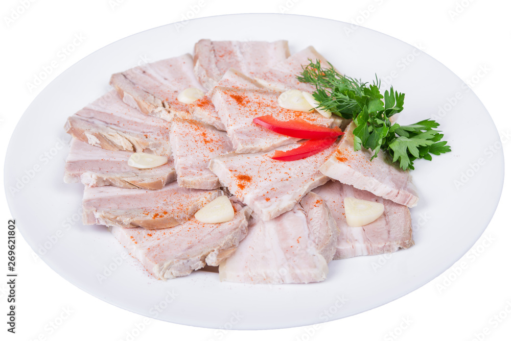 Sliced baked meat with garlic in a plate