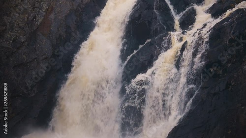 Static shot of the stream, at Hepokongas waterfall, on a sunny, spring day. in Puolanka, Kainuu, Finland 
50fps photo