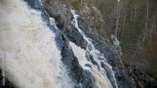 Hepokongas waterfall, a static shot close to the streams, on a spring day, in Puolanka, Kainuu region,  Finland 50fps photo