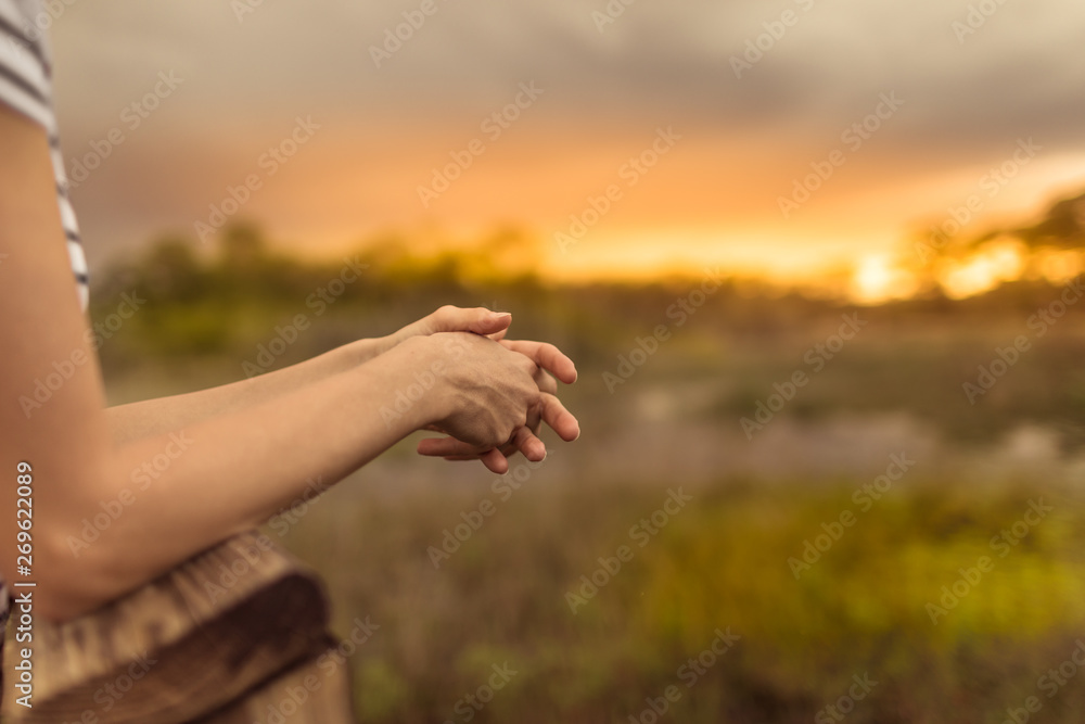 Woman relaxing on wooden dock by a beautiful lake. Peace and tranquility in nature. Woman relaxing on wooden dock by a beautiful lake. Peace and tranquility in nature.