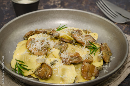 Ravioli with mushrooms and gorgonzola cheese, Italian cuisine 