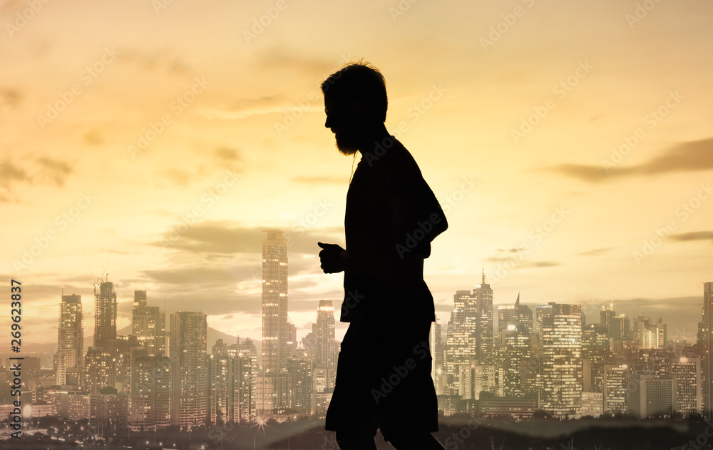 Fototapeta premium Silhouette of man running in the city