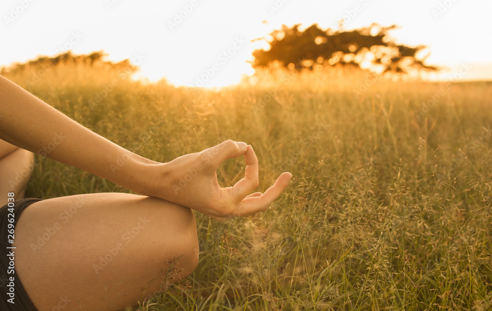 woman Meditating in field of wheat woman Meditating in field of wheat