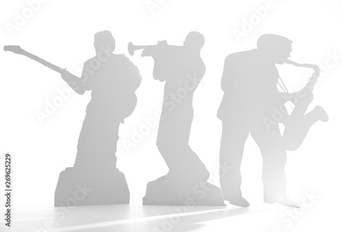 Shadow of a musician on white background