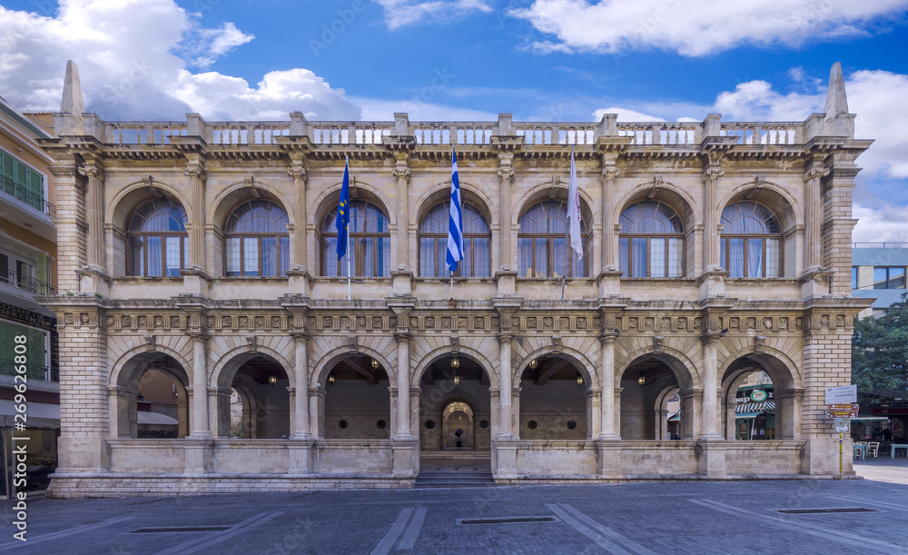 Heraklion, Crete Island / Greece. The Venetian Loggia building facade. It is the building that houses the town hall of Heraklion city today. Panoramic view, cloudy sky