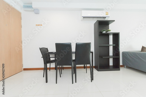 Stylish kitchen interior with dining table and chairs