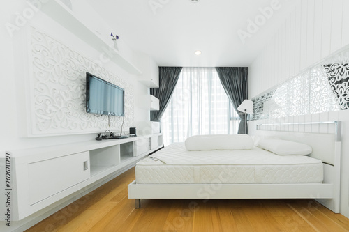 Warm bedroom interior with a comfy bed 