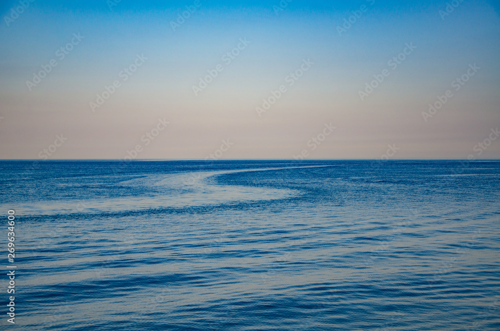 Seascape, view of sea horizon and sky at sunset