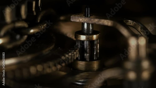 mechanism with rotating gears and a chain, similar to the clock mechanism or any other device in the old style