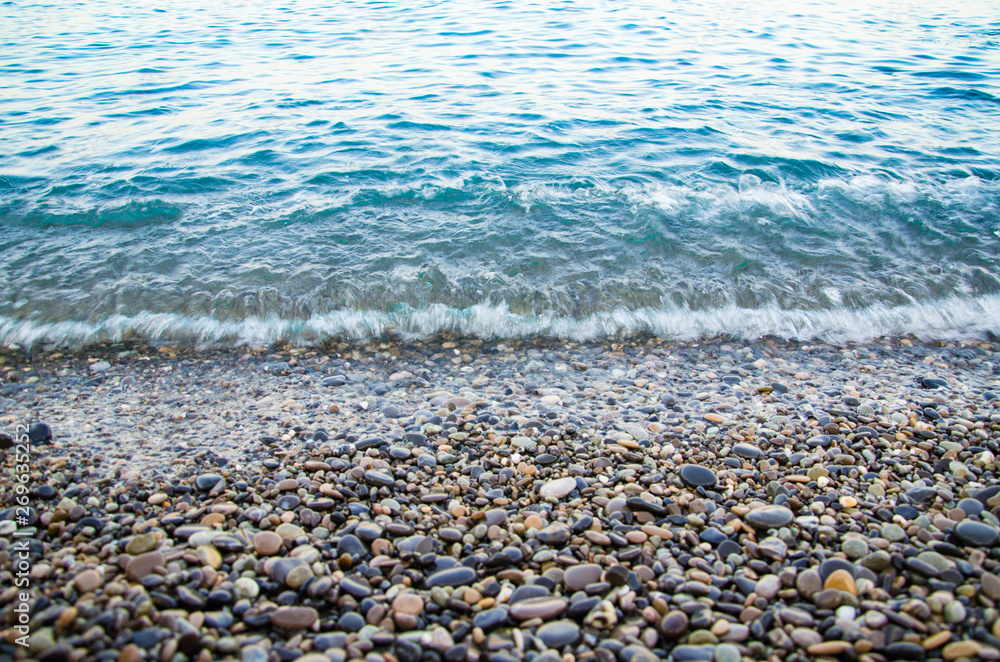 Seascape, view of stone beach and sea waves Seascape, view of stone beach and sea waves