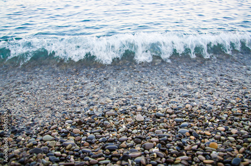 Seascape, view of stone beach and sea waves