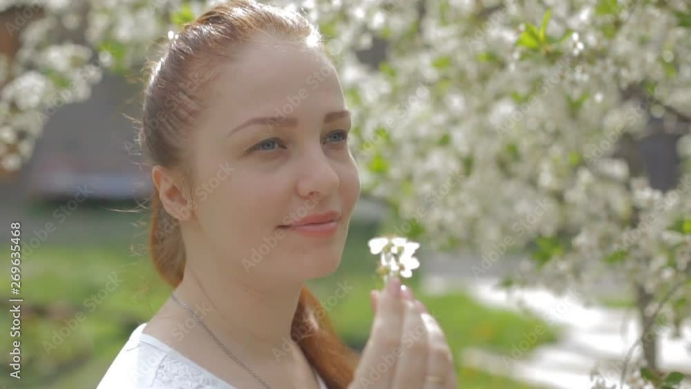 portrait of a woman in a beautiful blooming garden portrait of a woman in a beautiful blooming garden