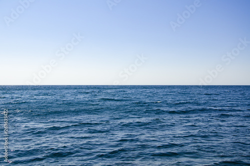 Seascape, view of sea horizon and blue sky