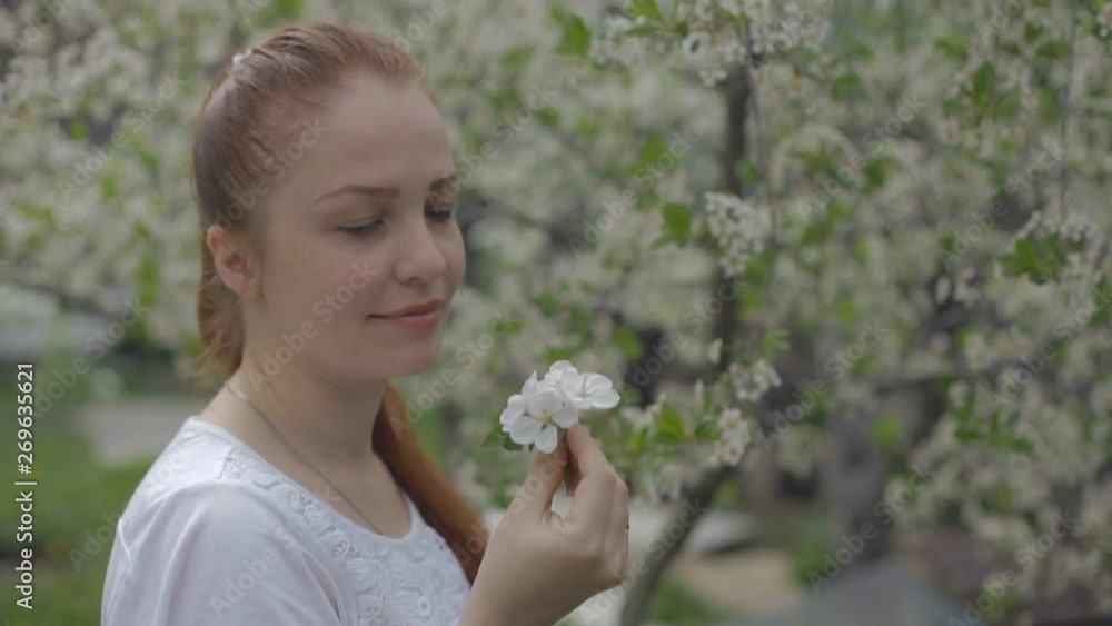 portrait of a woman in a beautiful blooming garden portrait of a woman in a beautiful blooming garden