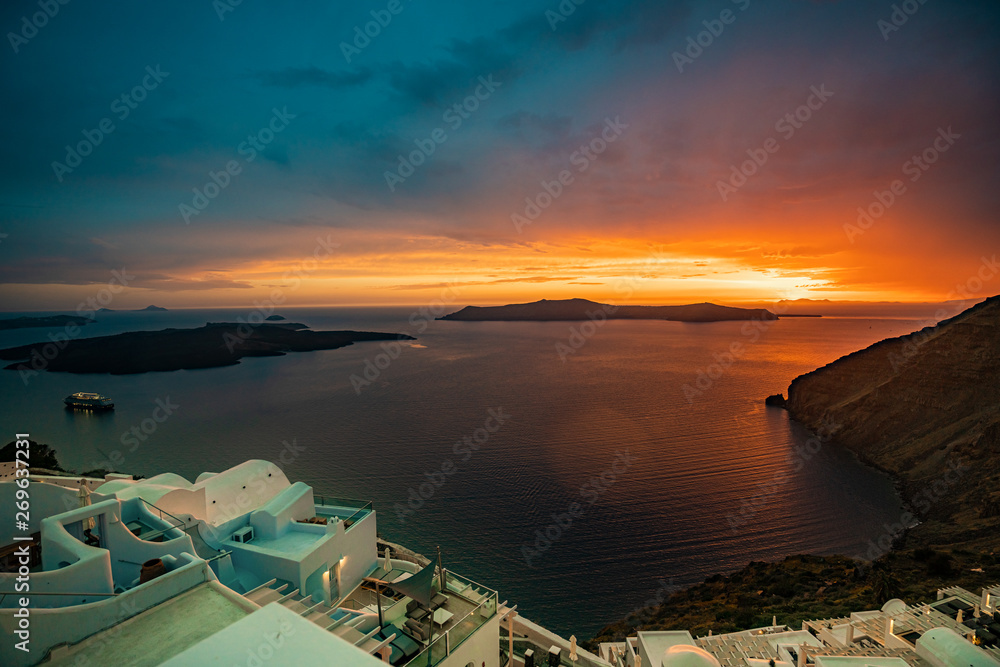Obraz premium Unique Sunset Colors at Santorini Island, Greece, one of the most beautiful travel destinations of the world.