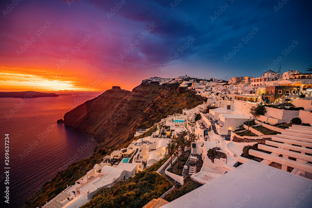 Unique Sunset Colors at Santorini Island,  Greece, one of the most beautiful travel destinations of the world. - obrazy, fototapety, plakaty 