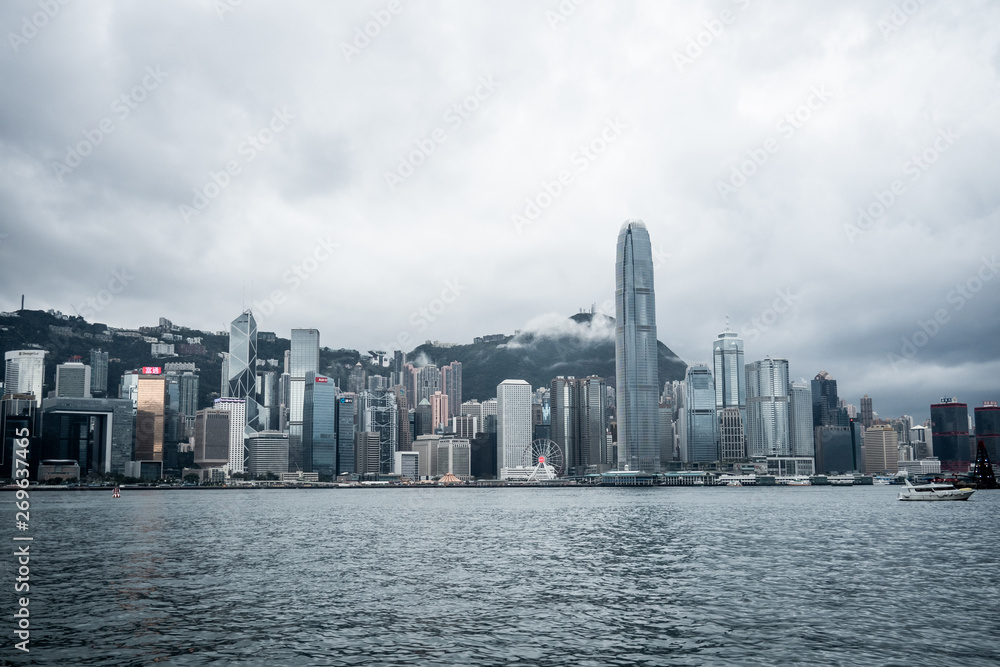 Hong Kong / China - Feb 19 2019: Victoria harbour skyline panorama. Background skyscraper building of big city