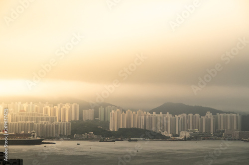 hong kong harbour skyline with panorama building in morning light. background concept for big city and urban life. © Panithan