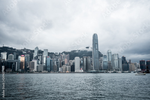 Hong Kong / China - Feb 19 2019: Victoria harbour skyline panorama. Background skyscraper building of big city © Panithan