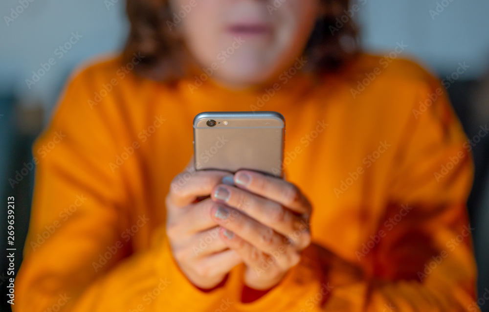 Close up of young woman hands using smartphone in Phone Addiction and Mobile Gaming concept Close up of young woman hands using smartphone in Phone Addiction and Mobile Gaming concept