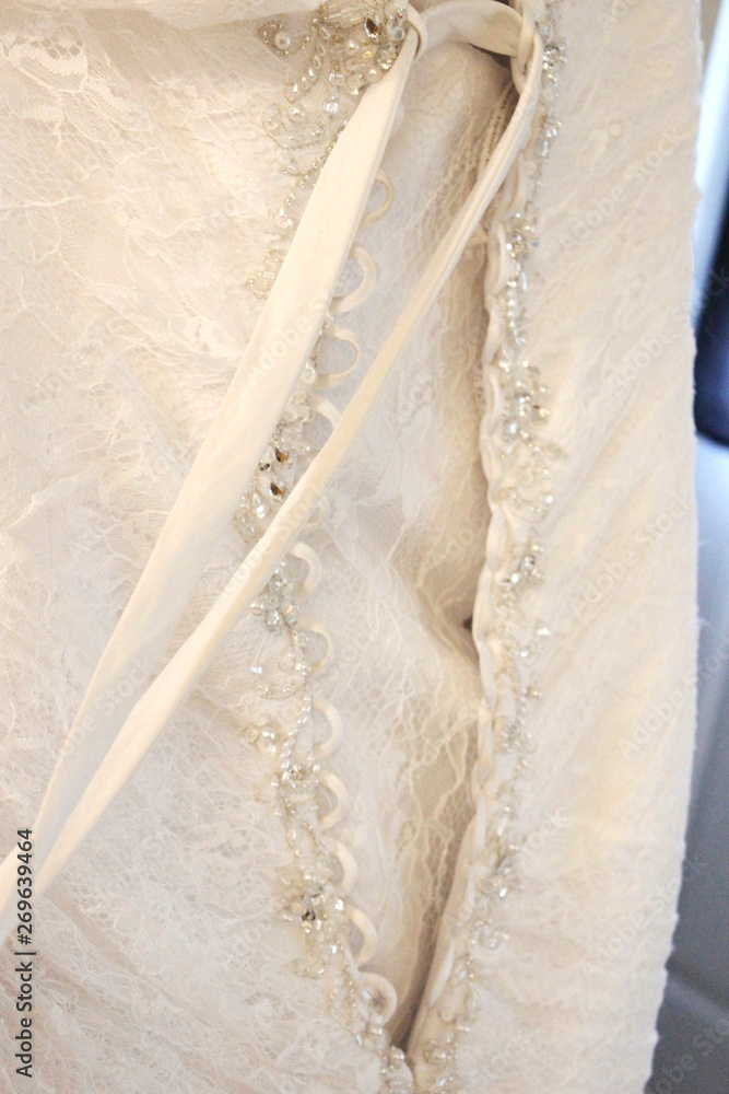 Back of a wedding dress with string and sparkle