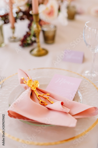 Wedding decoration table in the hall, floral arrangement. In the style vintage. Decorated dining table with flowers for guests and newlyweds, in peach-pink & pastel color. Beautiful table setting.