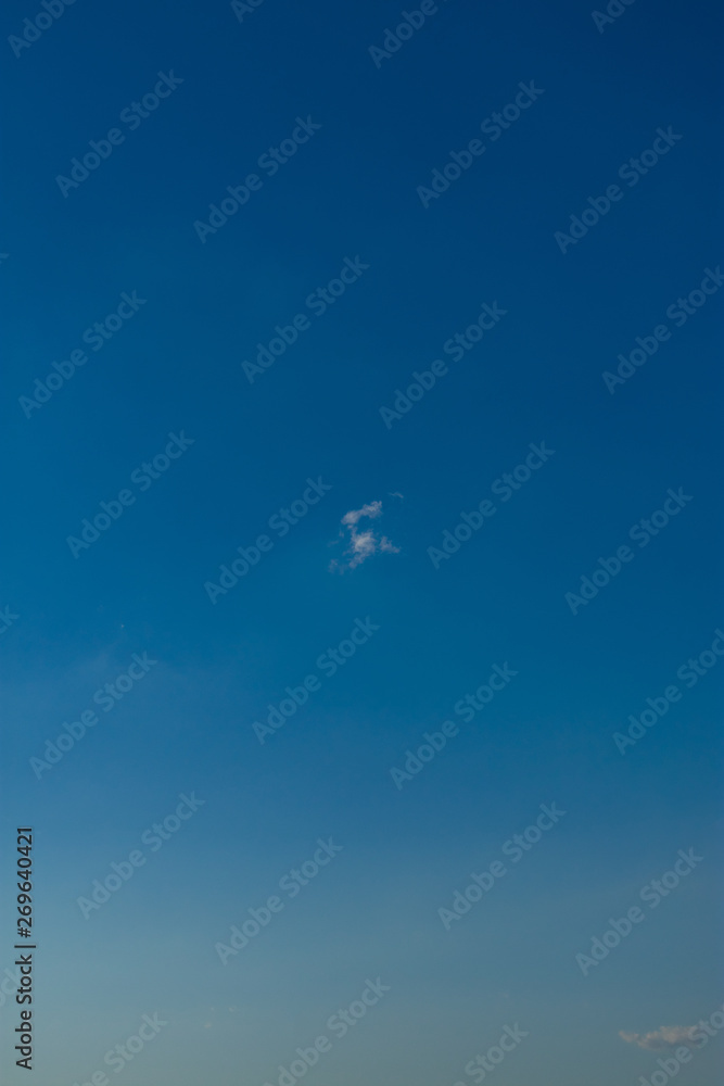 White cloud against blue sky. Single white cloud against a blue sky. White cloud blue sky.