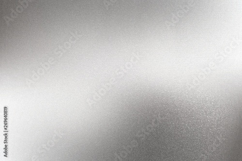Glowing brushed silver steel wall surface, abstract texture background