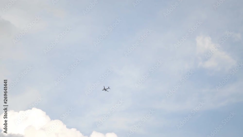 Flight of the passenger aircraft on the background of clouds Flight of the passenger aircraft on the background of clouds