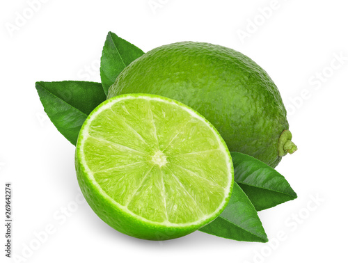 whole and half green lime with  leaves isolated on white background