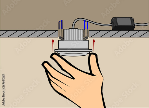 hand engaging a spot light, wiring