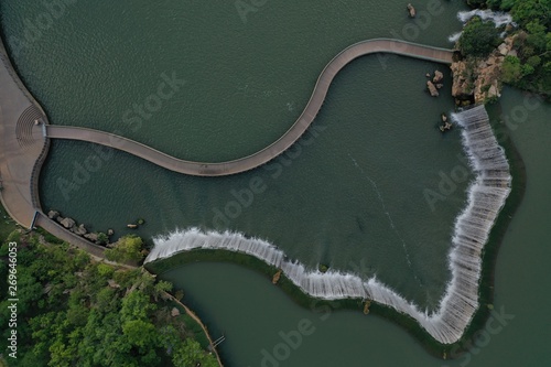 Aerial view of the Kunming Waterfall Park at sunset, one of the largest manamde waterfalls in the world photo