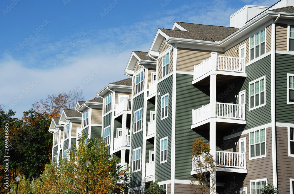 apartment building with spring trees landscape