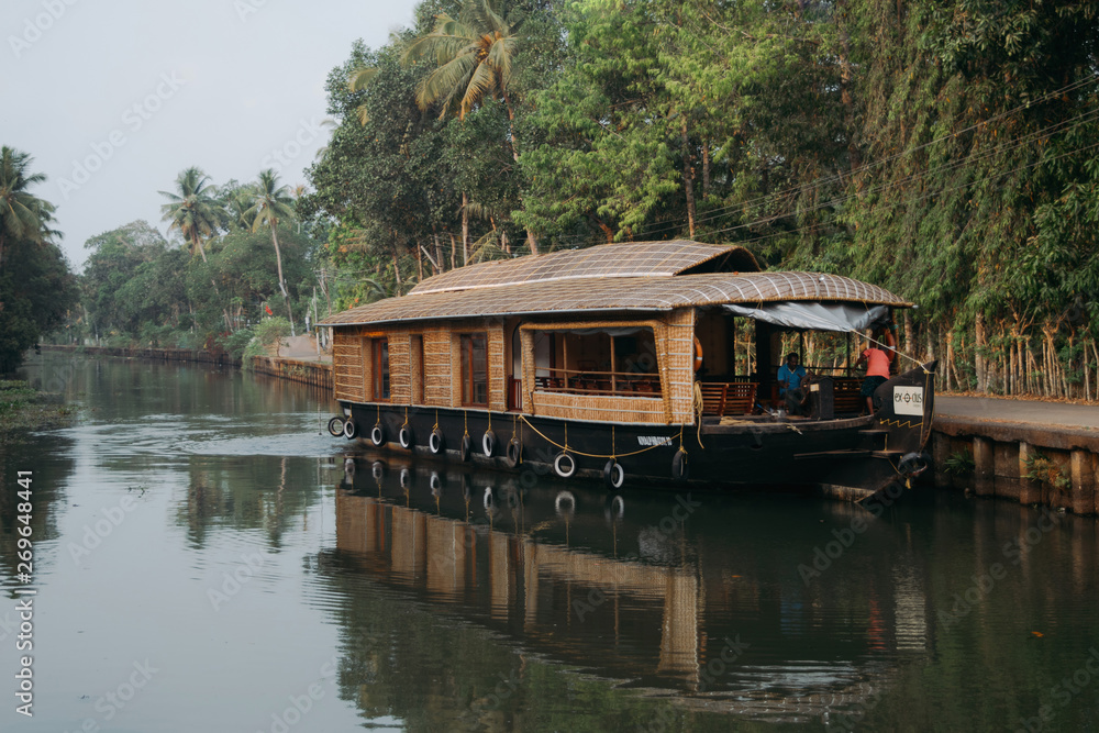 Traditional indian houseboat floating in backwaters of Kerala Traditional indian houseboat floating in backwaters of Kerala