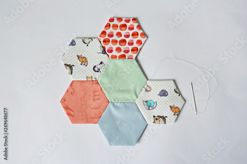 Hexagon templates and needle over white